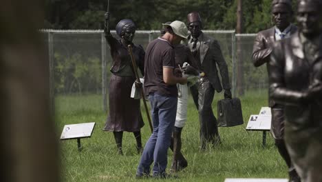 Restorer-Fixing-Gandhi-Sculpture-At-National-Heritage-Monument-In-Cape-Town,-South-Africa