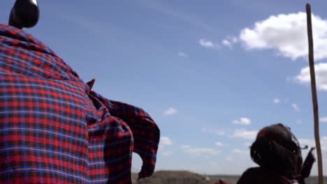 Close-Up-of-Maasai-Tribe-Males-Dancing-With-Wooden-Sticks