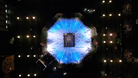 Top-down-aerial-footage-of-the-ice-skating-rink-in-Kungstragarden-in-Stockholm,-Sweden