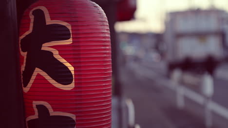 Spinning-Red-Lantern-outside-shop-in-street