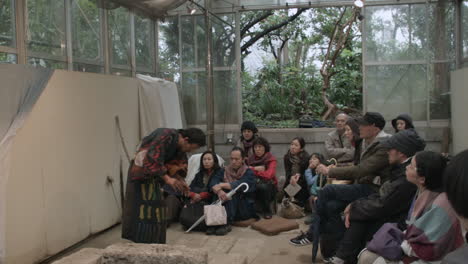 Japanese-actor-performing-a-Butoh-dance-in-play-in-front-of-small-audience