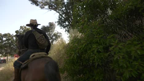 cowboy-passes-by-on-saddle