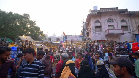 Indian-crowded-and-busy-market,-Indian-women-wearing-traditional-hijab-walking-through-the-market-outside-Charminar-for-shopping,-Old-Hyderabad