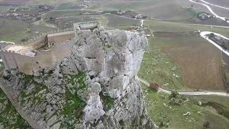 Drone-shot-rotating-in-a-spiral-around-the-Castle-of-Mussomeli-in-Sicily