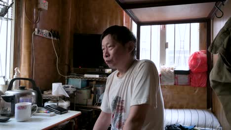 A-low-income-tenant-lives-in-a-cubicle-room-flat-as-he-shares-an-apartment-with-other-renters