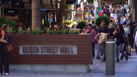 Large-crowds-of-people-in-bustling-downtown-Brisbane-city,-strolling-and-shopping-at-iconic-Queen-street-mall,-outdoor-pedestrian-shopping-mall-at-Queensland-Australia,-static-shot