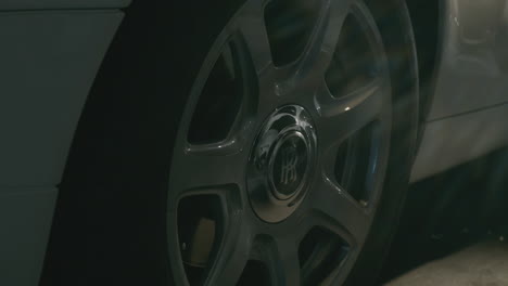 Rolls-Royce-car-tire-with-light-reflecting-shiny-surface,-close-up-wheel,-side-view