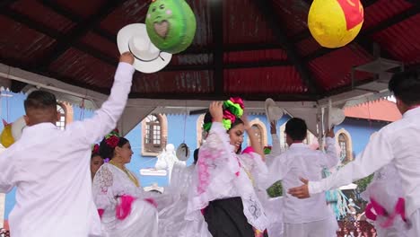 slow-motion-shot-of-couple-traditional-dance-with-bows-in-mineral-del-chico-Hidalgo-Mexico