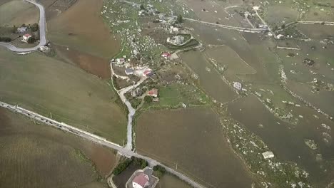 Drone-shot-tilting-from-the-Mussomeli-Chiaramonte-Castle-to-the-country-side