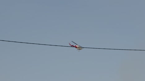 A-water-bombing-helicopter-going-to-collect-water-before-returning-to-a-rural-bushfire