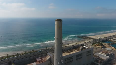 Cinematic-drone-shot-of-smokestack-at-the-NRG-Encina-Power-Plant-on-the-coast-of-Carlsbad,-CA