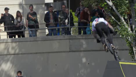 Close-up-of-a-BMX-rider-performing-a-360-whip-tail-trick-in-the-air