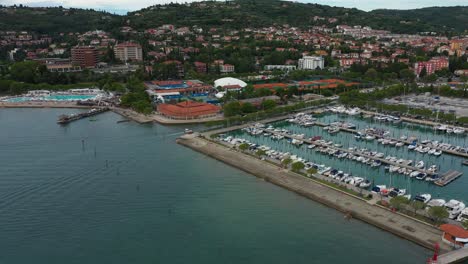 Drone-aerial-fast-forward-flying-seaside-coastal-view-of-Portoroz-ATP-Challenger-Slovenia-Open-tennis-grounds