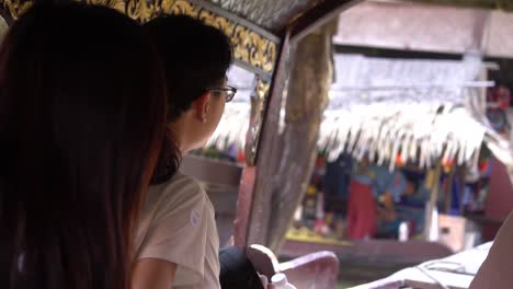 Tourists-in-Sailing-Boat-in-Traditional-Floating-Market-Sightseeing,-Thailand,-Close-Up-Slow-Motion