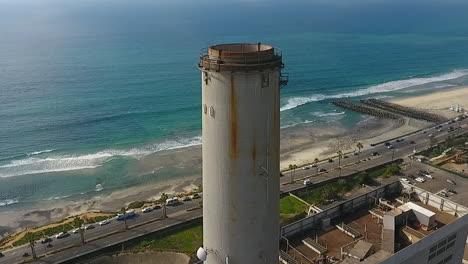 Cinematic-drone-shot-of-smokestack-at-the-NRG-Encina-Power-Plant-on-the-coast-of-Carlsbad,-CA