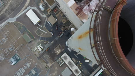 Cinematic-drone-shot-of-smokestack-at-the-NRG-Encina-Power-Plant-on-the-coast-of-Carlsbad,-CA