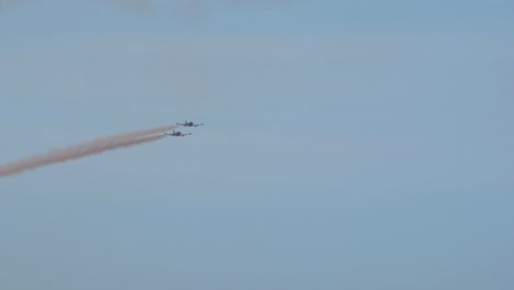 Zoom-in-shot-of-two-BAC-strikemasters-flying-above-sea-during-airshow-in-Bournemouth,-England