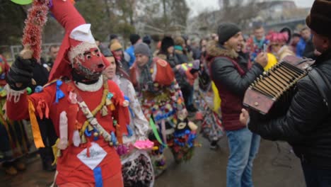 People-celebrating-the-annual-Romanian-Bear-Festival-on-the-street---mid-shot