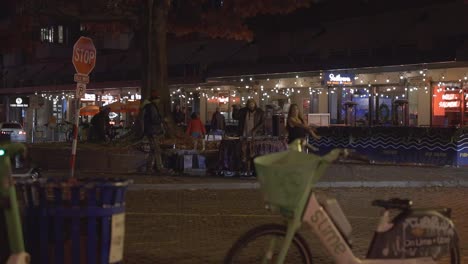 DJ-performing-on-street-corner-while-someone-dances