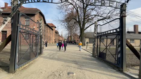 Tourists-visiting-memorial-site-of-Auschwitz,-German-Nazi-concentration-camps-and-extermination-centres