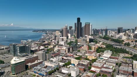 Wide-establishing-aerial-view-of-Seattle's-International-District-with-skyscrapers-and-the-Puget-Sound-in-the-background