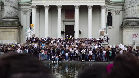 A-young-crowd-is-demonstrating-in-front-of-an-important-building-in-Vienna-against-racism