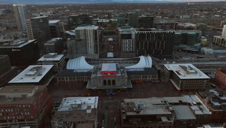 Aerial-Drone-Reverse-reveal-of-Union-Station-in-downtown-Denver-Colorado-USA-at-sunset-on-a-winter-day