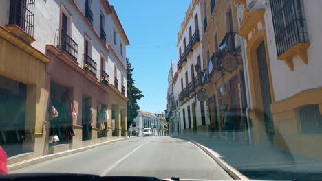 POV-shot-driving-in-Ronda,-Spain,-sunny-summer-day