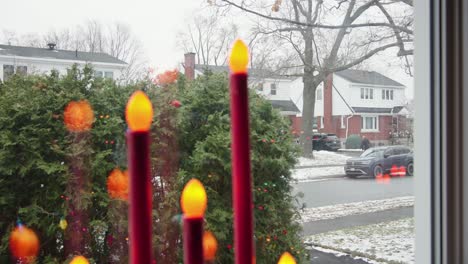 Rack-focus-from-traveller-returning-home-to-Candle-Lamps-in-windowsill