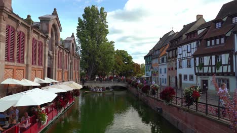 Tourists-Sail-in-a-Boat-near-Covered-Market-in-Fishmongers-district-in-Colmar