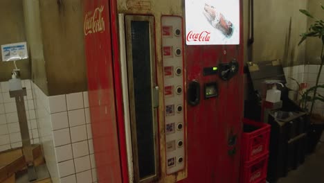 Slow-motion-tilt-down-over-Retro-Vending-Machine-in-Japan-1950's-Set-at-Ramen-Museum