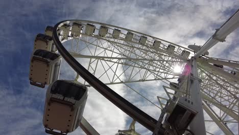 Ferris-wheel-in-Cape-Town-seen-from-below-with-the-sun-shining-through-it