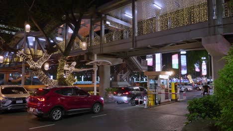 Moving-cars-passing-through-a-movable-barrier-at-a-toll-gate-in-the-city-of-Bangkok,-Thailand