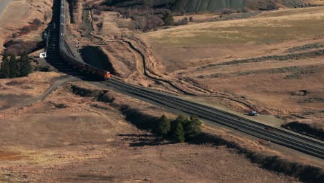 Drone-shot-tracking-along-a-BNSF-Railway-Train-as-it-travels-through-Montana