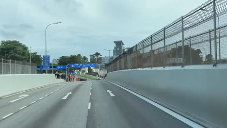 Dolly-in-shot-of-an-approaching-view-of-Woodlands-Checkpoint,-Singapore