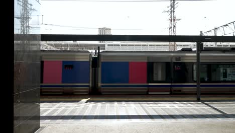 Local-Train-Passing-By-The-Platform-At-The-Train-Station