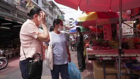 Police-Inspecting-Streets-and-Food-Stalls-in-Chinatown-in-Bangkok,-Thailand