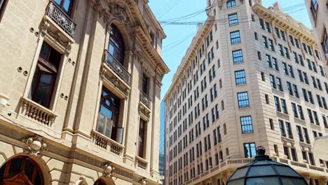 People-Walk-Around-La-Bolsa-Neighborhood-Old-Historic-City-with-Warm-Skyline-and-Heritage-Buildings