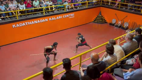 pov-shot-Tourists-are-clapping-and-watching-Lathi-Baji-in-the-arena