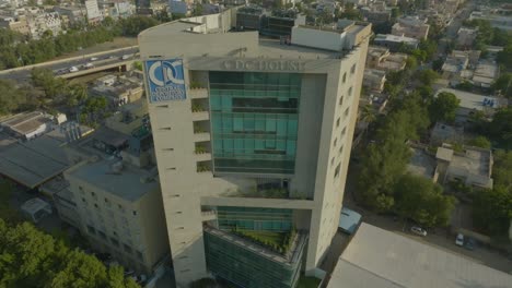 CDC-Tower-Amidst-Greenery,-Karachi---Aerial