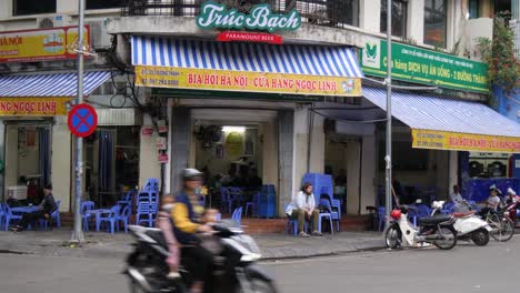 Lone-tourist-sits-at-bar,-savouring-his-drink-and-takes-in-the-surroundings