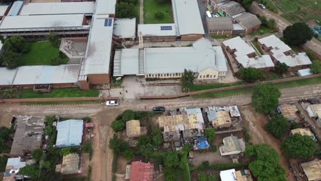 Drone-video-of-a-catholic-mission-school-campus-at-a-high-density-suburb-township-in-Bulawayo,-Zimbabwe