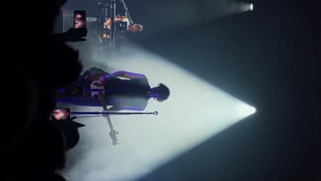 Vertical-close-up-handheld-shot-of-Tyson-Ritter-and-the-All-American-Rejects-band-playing,-singing,-and-performing-live-in-concert-at-the-The-Great-Saltair-Amphitheater-in-Utah-with-flashing-lights