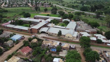 Drone-video-of-a-catholic-mission-school-campus-at-a-high-density-suburb-township-in-Bulawayo,-Zimbabwe