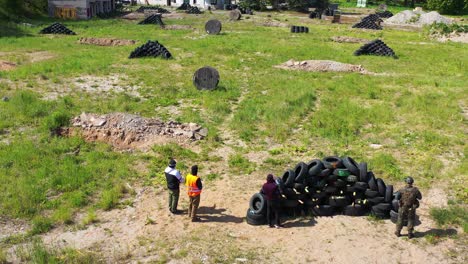 Outdoor-airsoft-players-wait-signal-in-attack-position-when-game-start