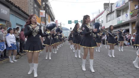 Dancing-Majorettes-twirl-batons-town-Independence-day-street-parade-slow-mo