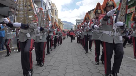 Uniform-marching-xylophone-band-street-parade-celbrations-slow-motion-pull-shot