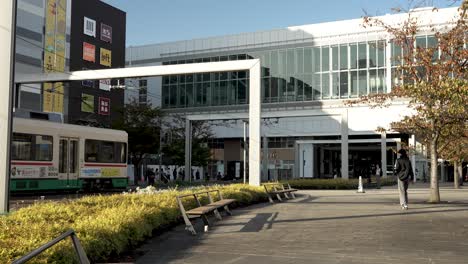 Tram-Approaching-Toyama-Station-And-Stopping-At-Crossing