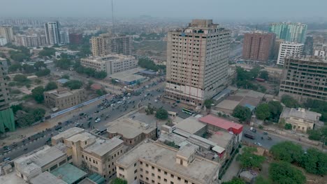 Forward-drone-shot-of-Saddar-in-Karachi-during-sunset-with-busy-traffic-in-Karachi,-Pakistan