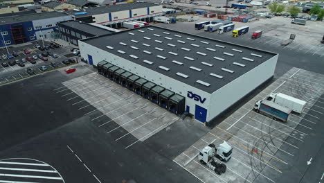 Aerial-view-of-a-large-industrial-warehouse-with-parking-and-loading-docks